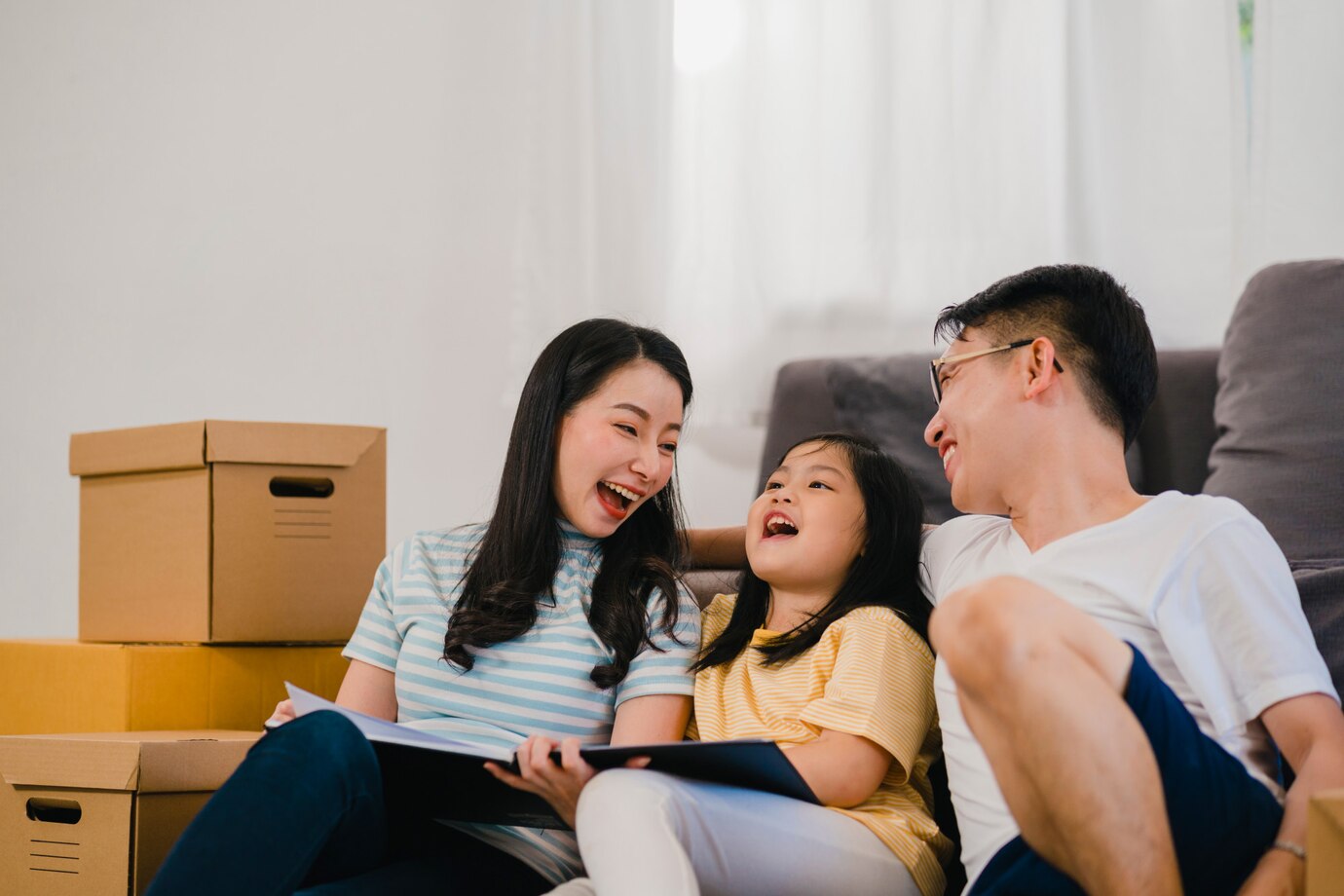 happy-forward-future-new-home-after-moving-relocation-sitting-floor-with-boxes-together_7861-2299
